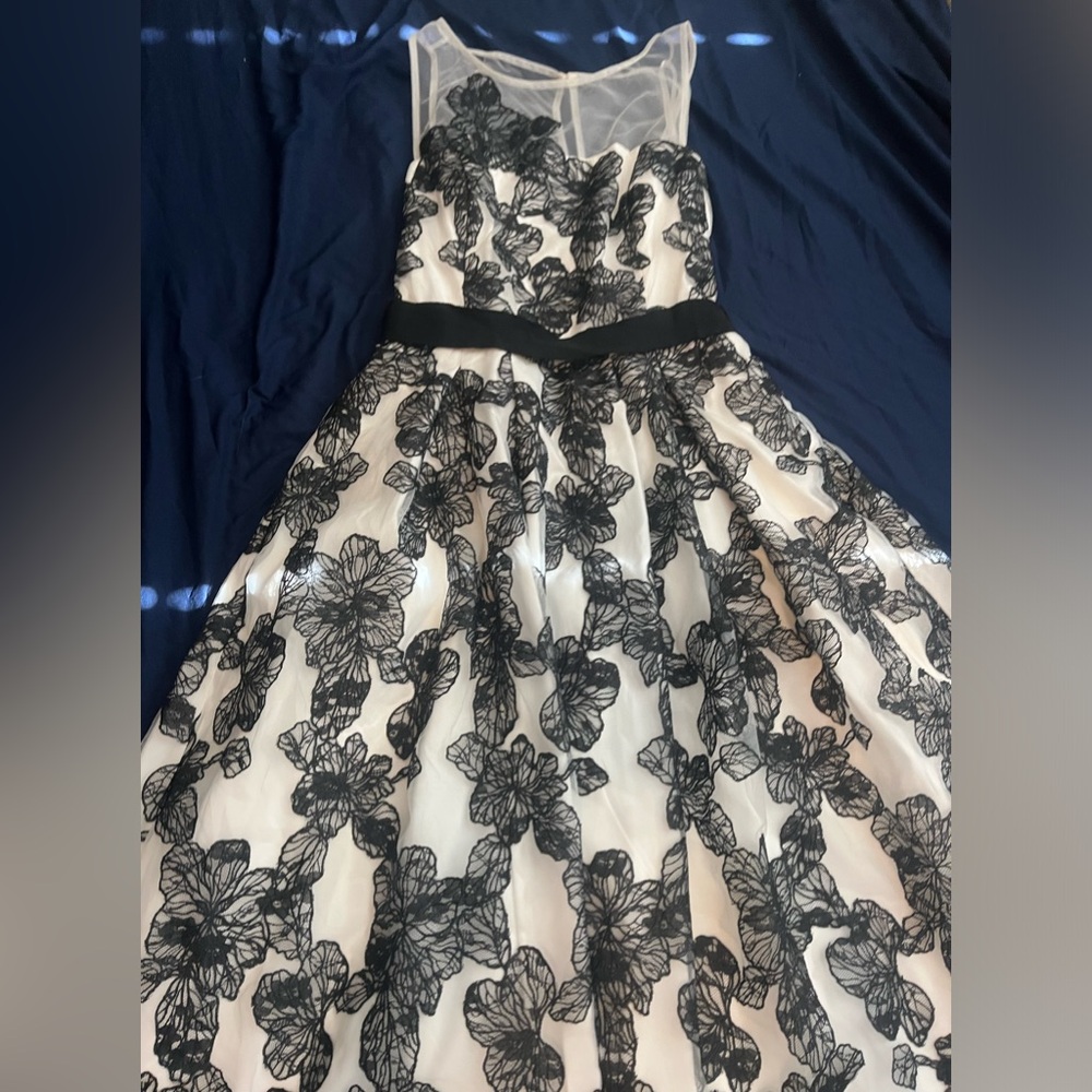 White dress with black flower detail